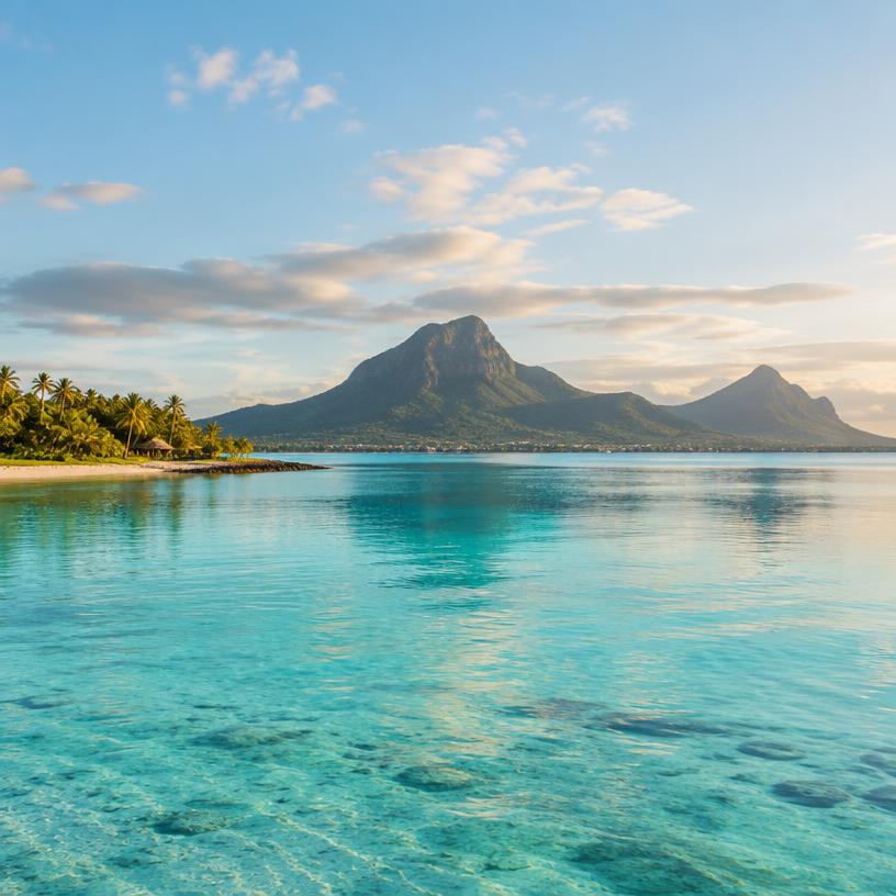 Mauritius lagoon with volcanic mountains and turquoise water